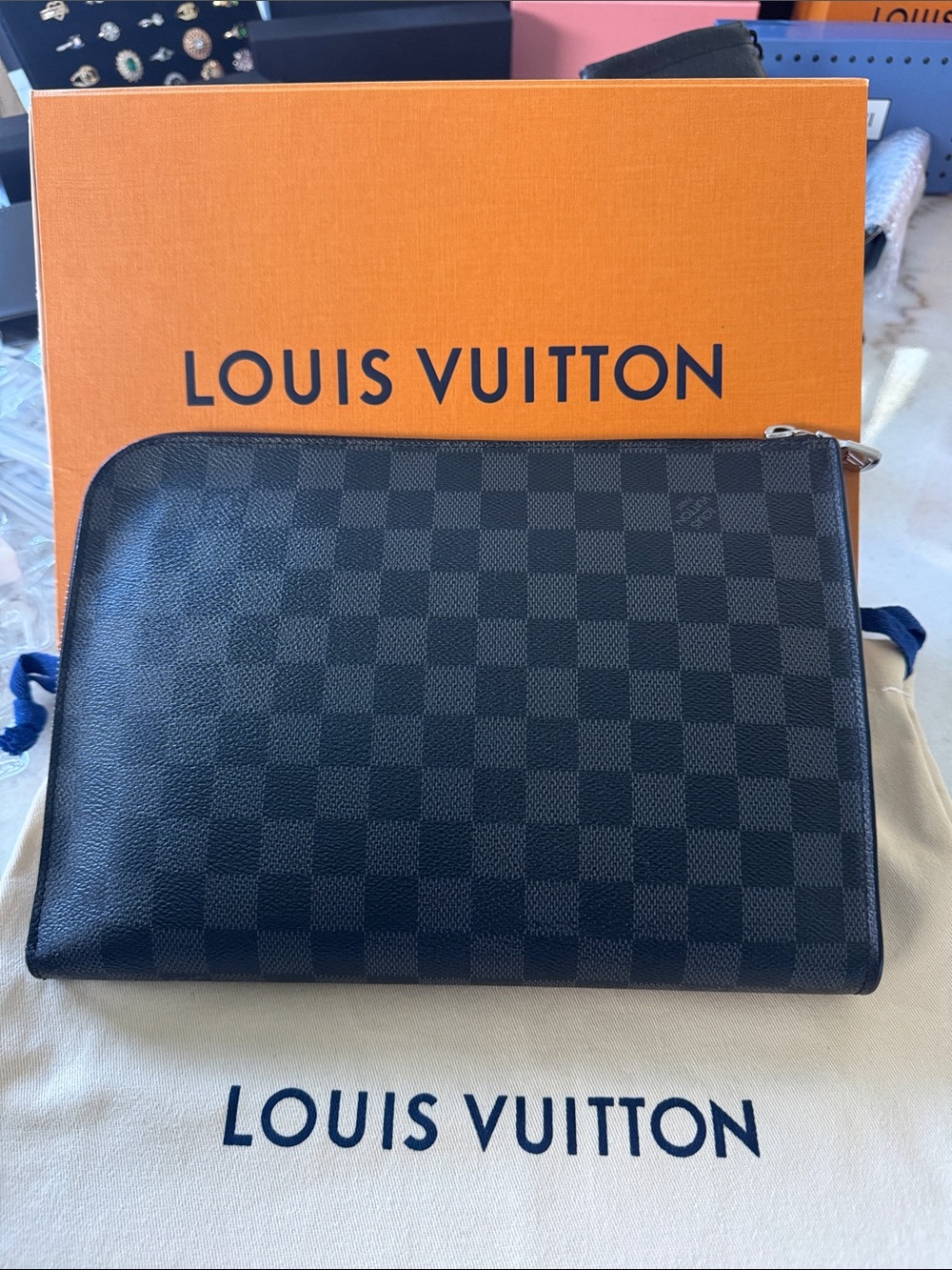 Authentic Louis Vuitton Damier Graphite Canvas clutch in Black.